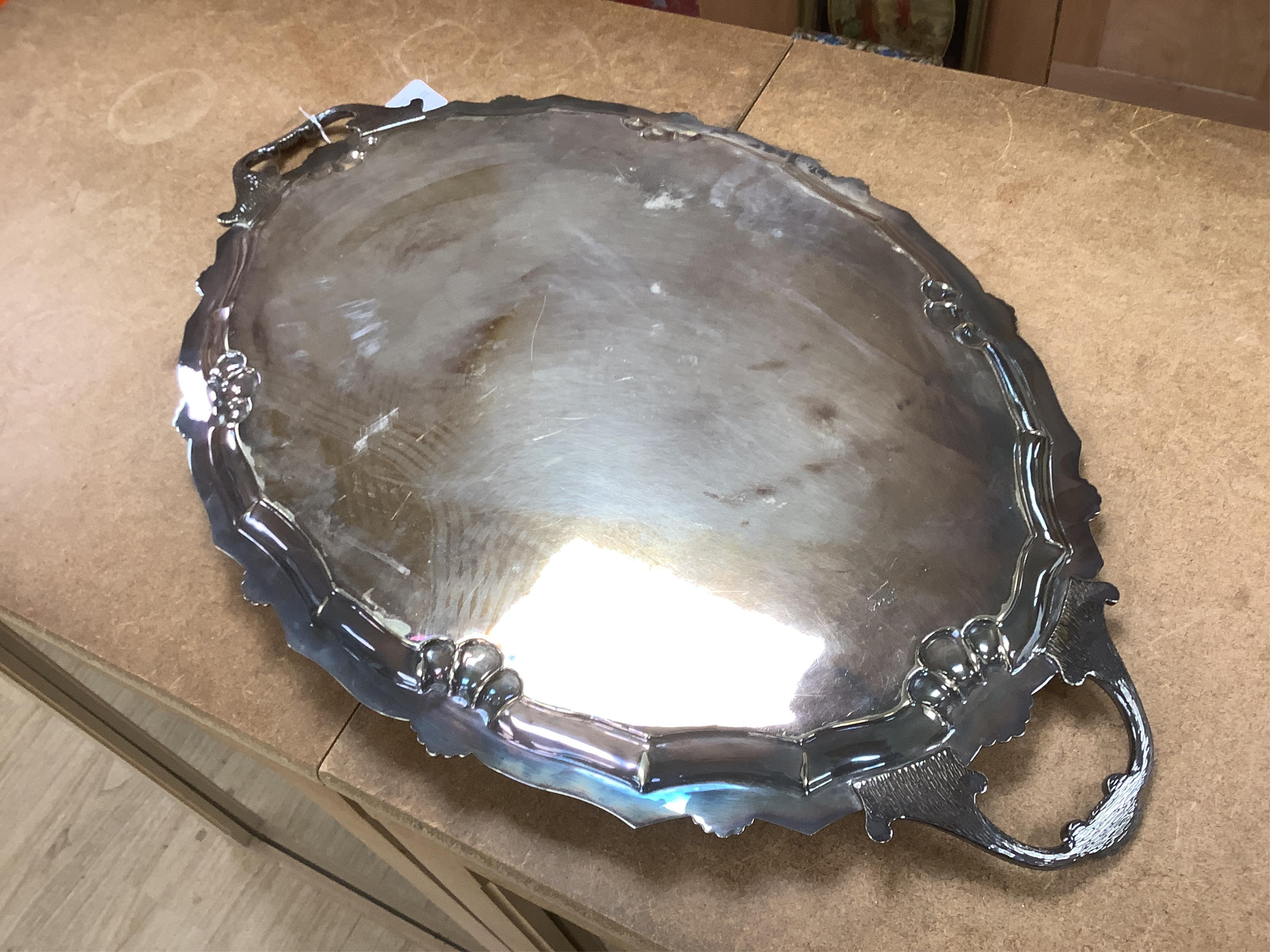 A large late Victorian plated two handled presentation tea tray, 71cm. Condition - fair